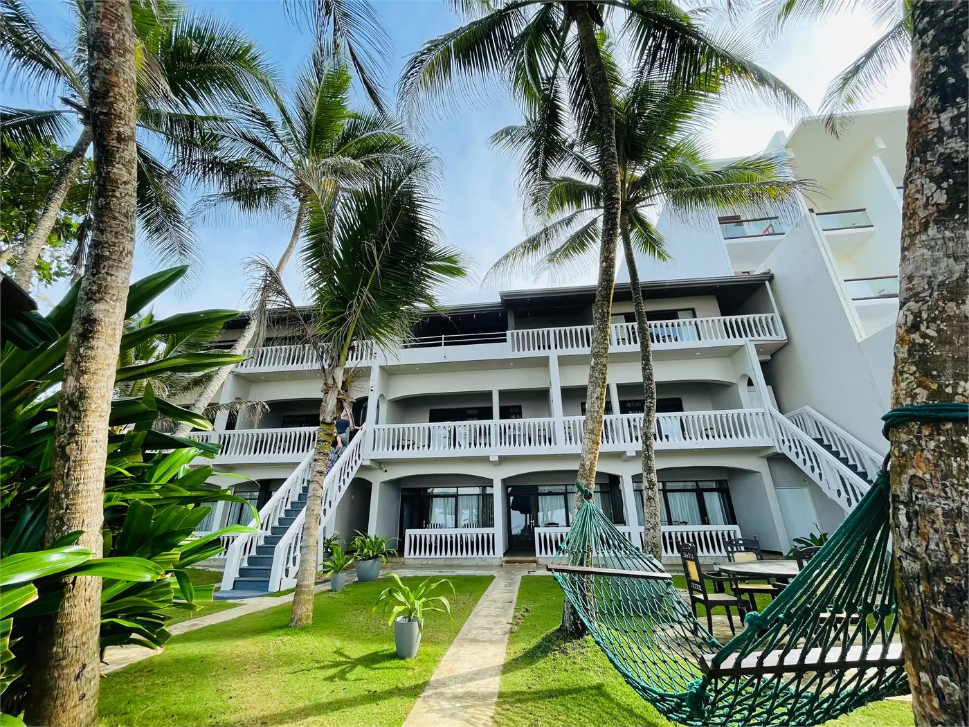 Suite Lanka garden front with palms and hammock
